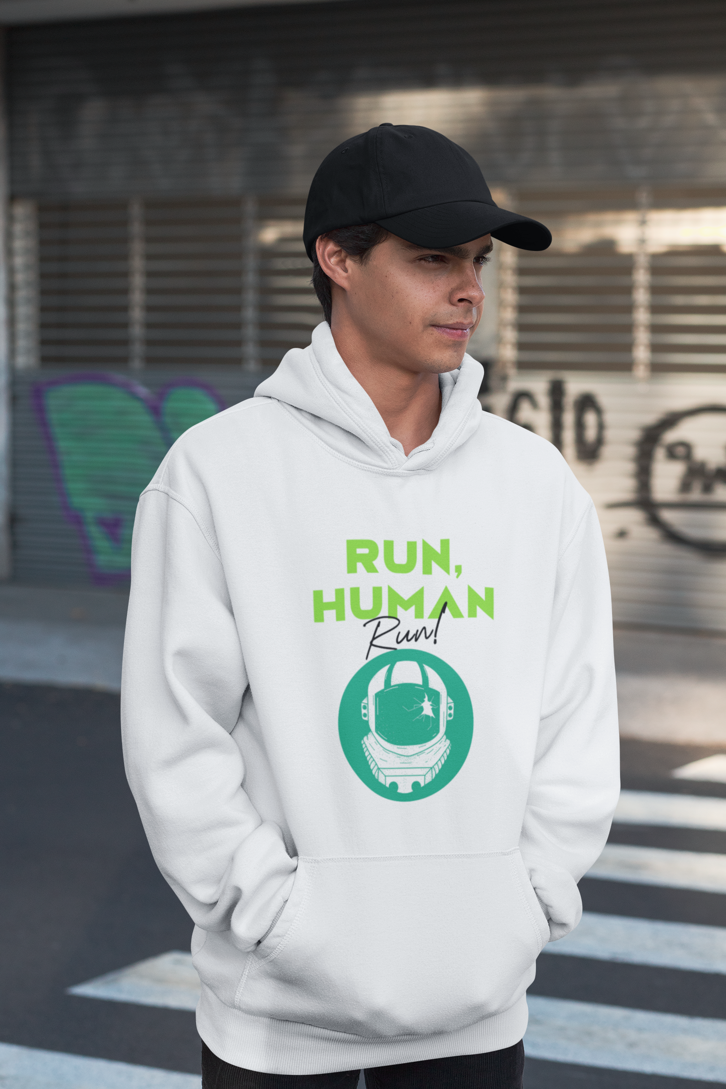 A person wearing a white hoodie with 'RUN, HUMAN RUN' text and a graphic on the front.