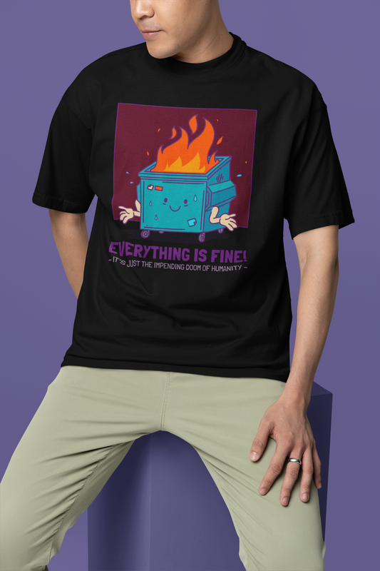 A person wearing a black oversized t-shirt with a graphic design and text that reads 'EVERYTHING IS FINE! Thanks for nothing. Goodnight.