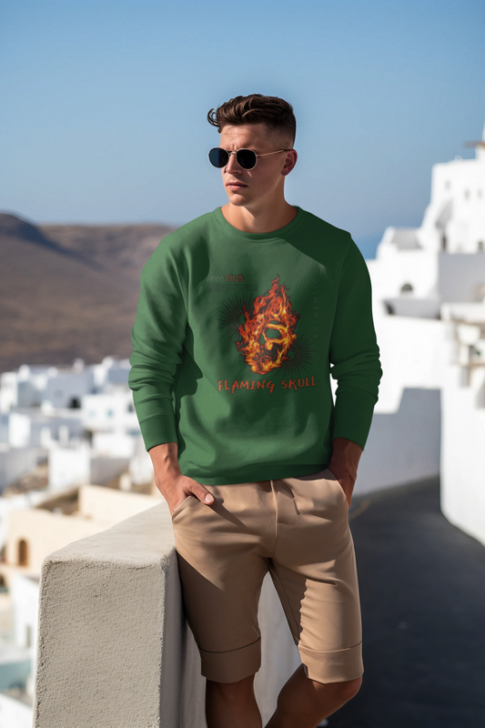 Man wearing a green sweatshirt with a flame design and beige shorts, standing in a scenic location.