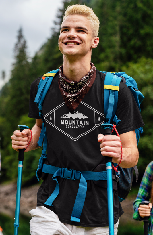 Person hiking with a backpack and poles in a forest
