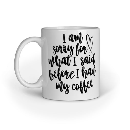 White mug with black text and heart design on a white background
