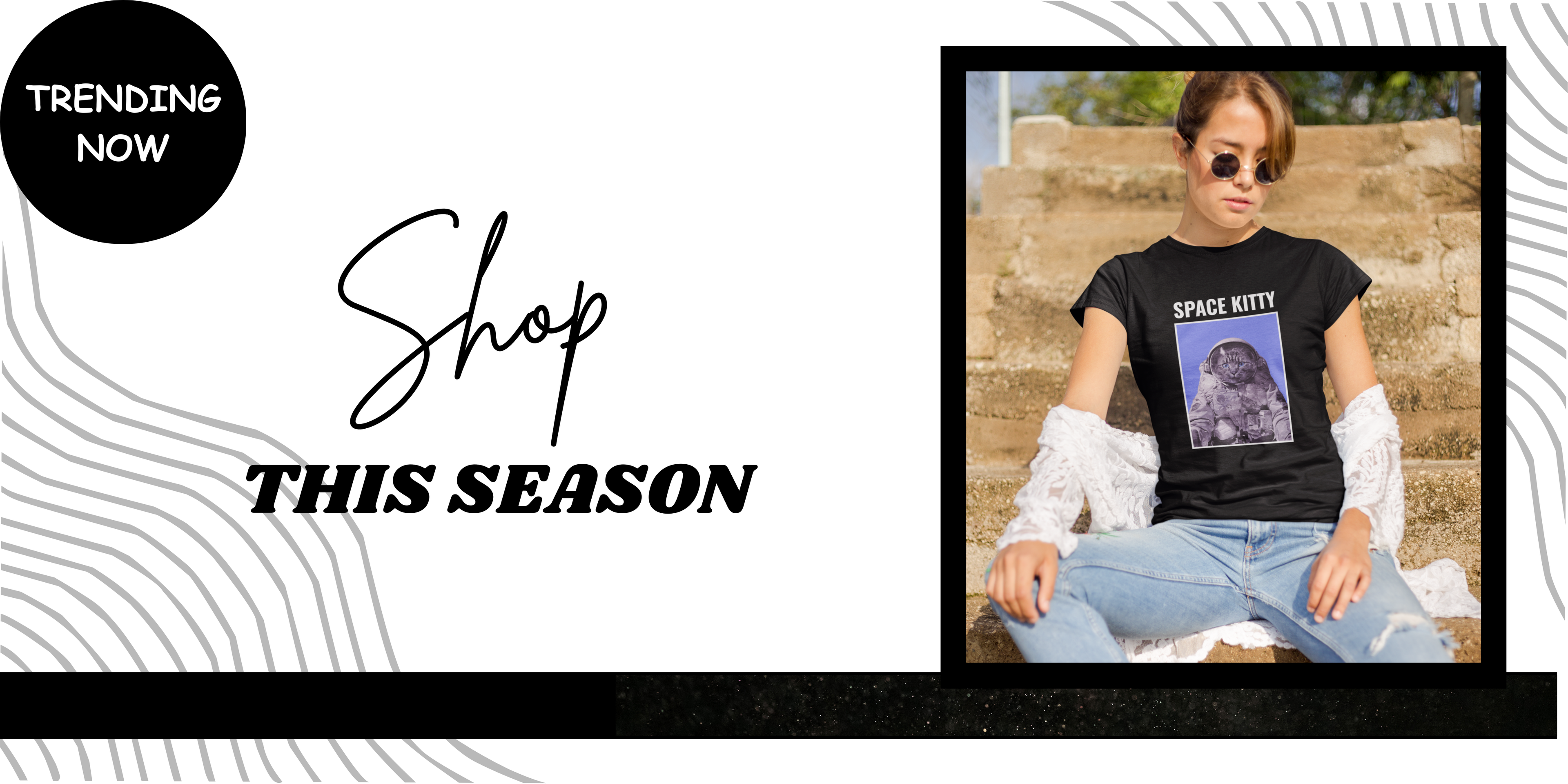 Trending graphic tee design for streetwear lovers featuring a black t-shirt with "Space Kitty" astronaut cat print. Stylish young model sitting on outdoor stairs, perfect for showcasing bold fashion, casual outfits, and seasonal t-shirt trends.

