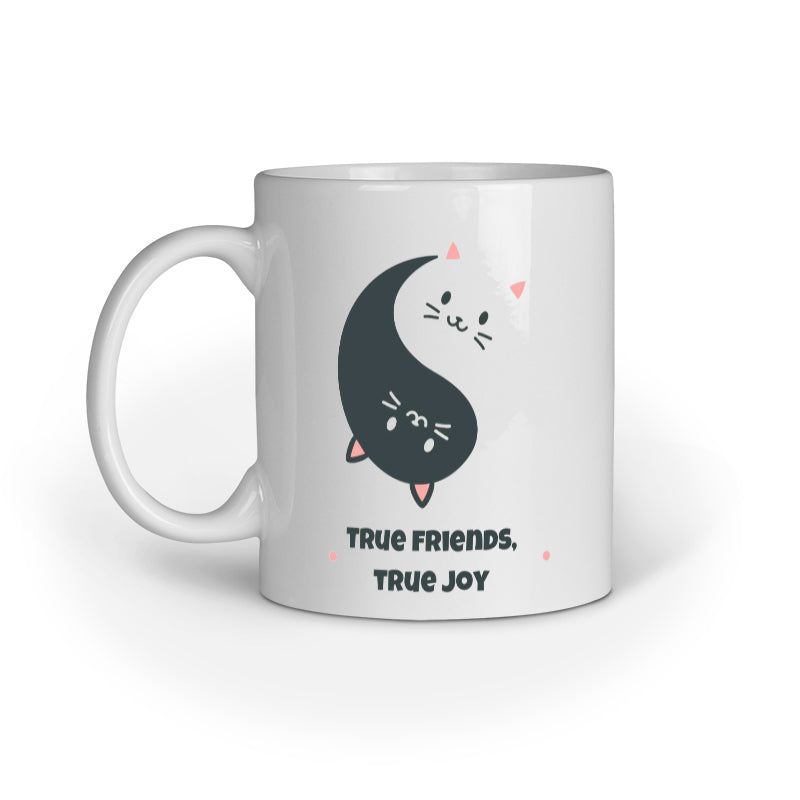 White mug with a yin yang design of a cat and text 'True Friends, True Joy' on a white background